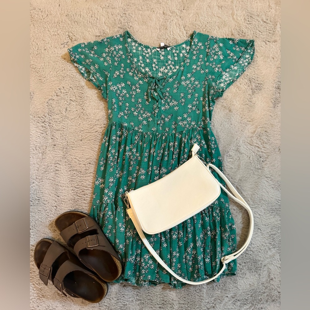 Tilly’s green floral dress. Patrons of Peace brand.